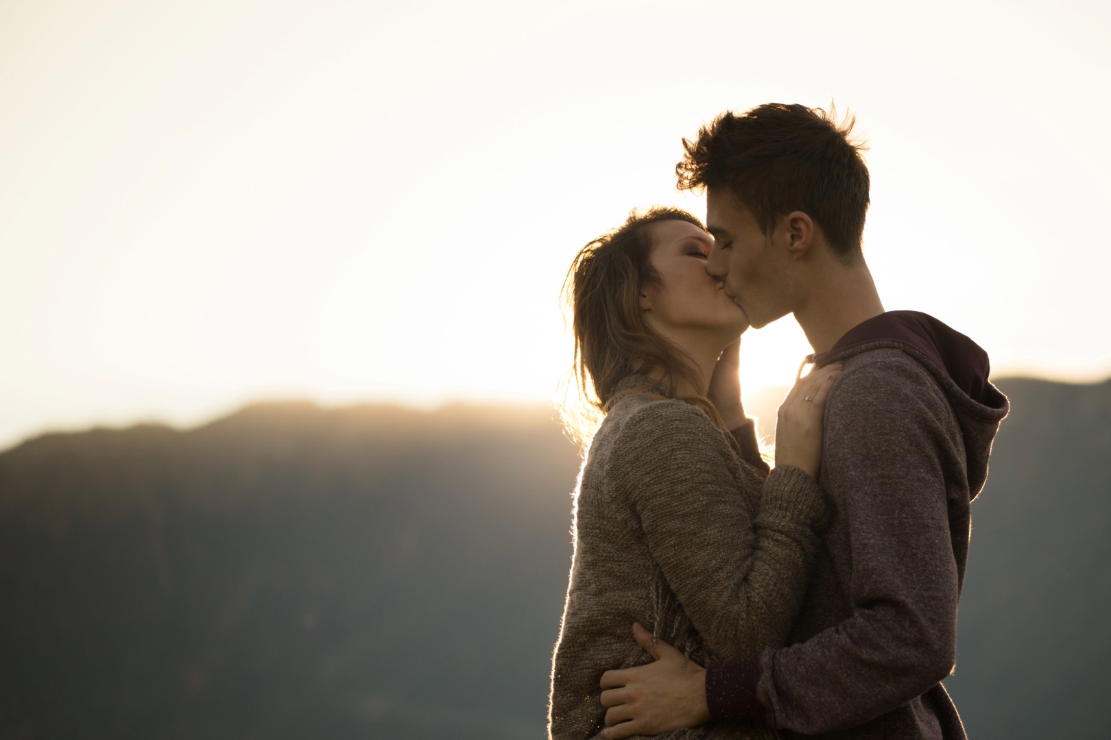 A couple embracing at sunset